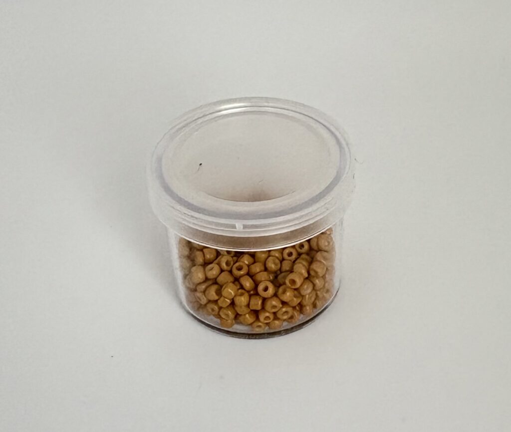 Small transparent pot with beads